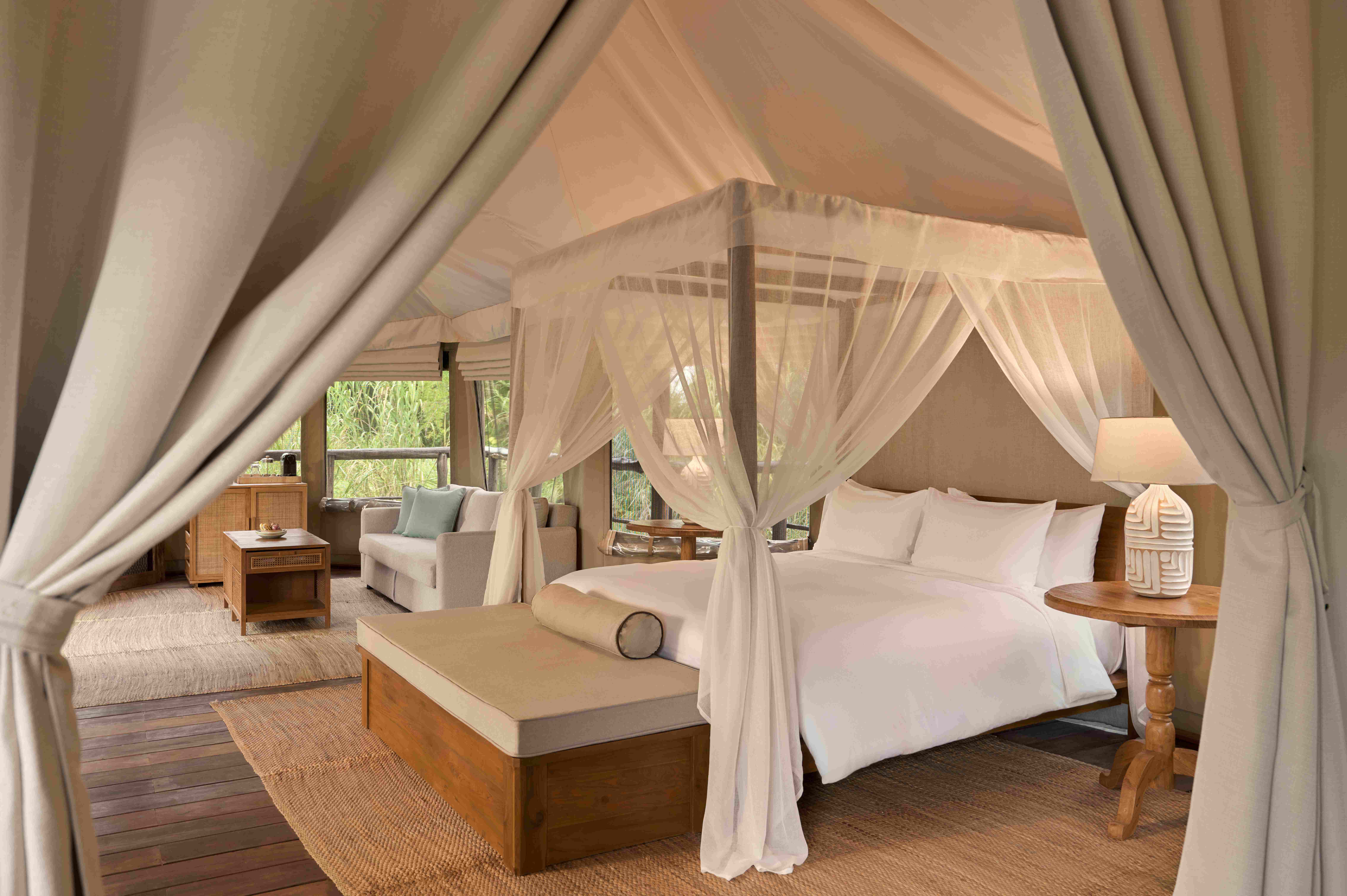 Tantawan Tented Camp features 10 spacious safari-style tents – from two-bedroom family options to a romantic one-bedroom suite – each with a private bathroom, handcrafted teak furnishings, and modern comforts designed in harmony with nature.