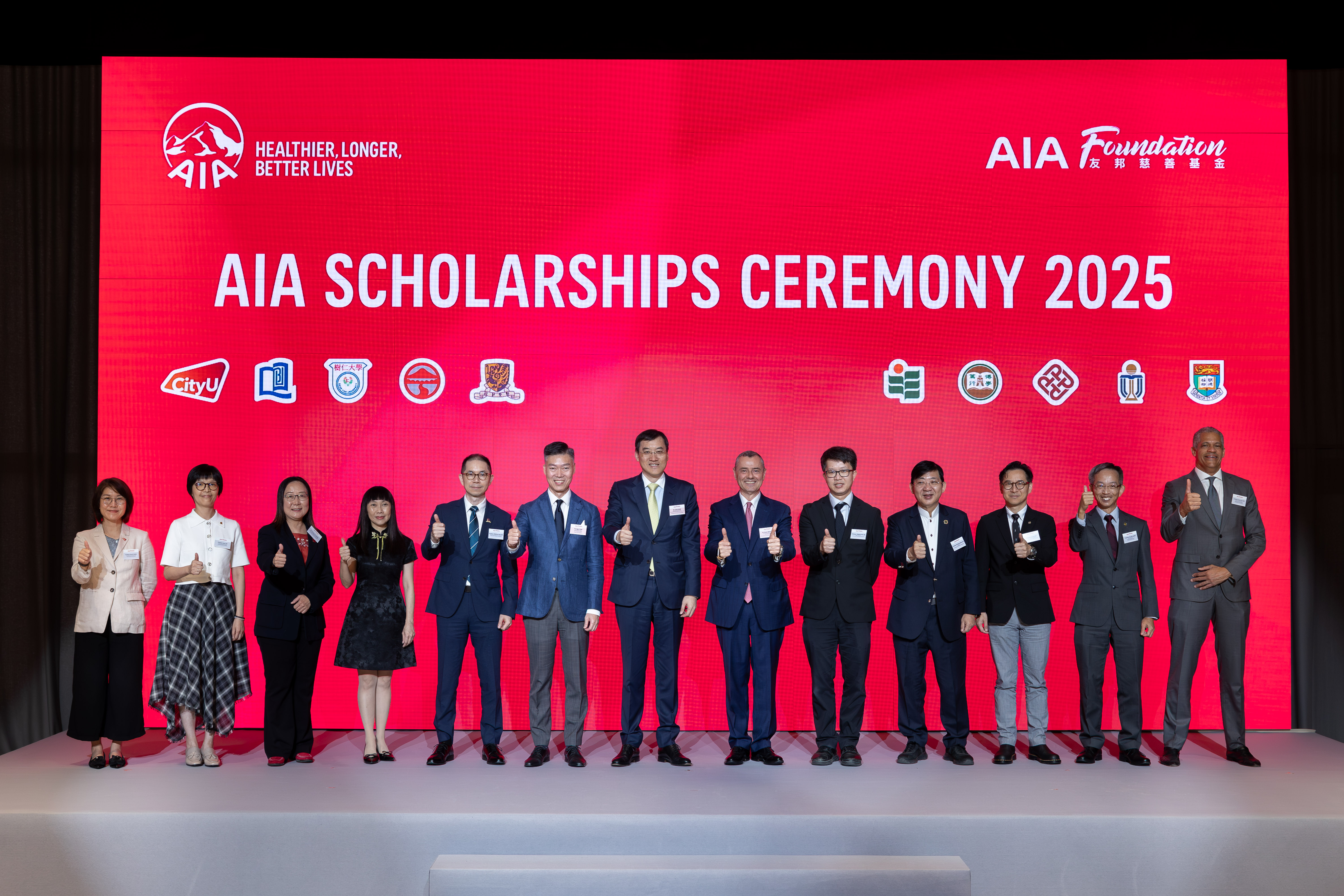 Mr. Jacky Chan, AIA Regional Chief Executive and Group Chief Distribution Officer; Co-chairman, AIA Scholarships Committee (seventh from left); Mr. Stuart A. Spencer, AIA Group Chief Marketing Officer; Co-chairman, AIA Scholarships Committee (sixth from right); and Mr. Alger Fung, Chief Executive Officer, AIA Hong Kong & Macau; Director of AIA Foundation (sixth from left), are pictured with representatives of the 10 universities at the celebration ceremony for the fifth cohort of AIA Scholarships recipients.